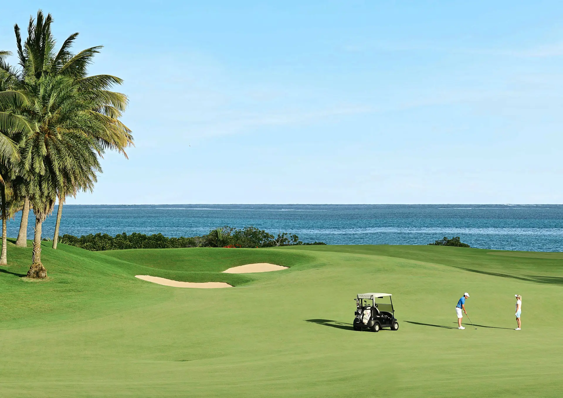 Golfbane med spillere på Anahita Golf & Spa Resort, Mauritius